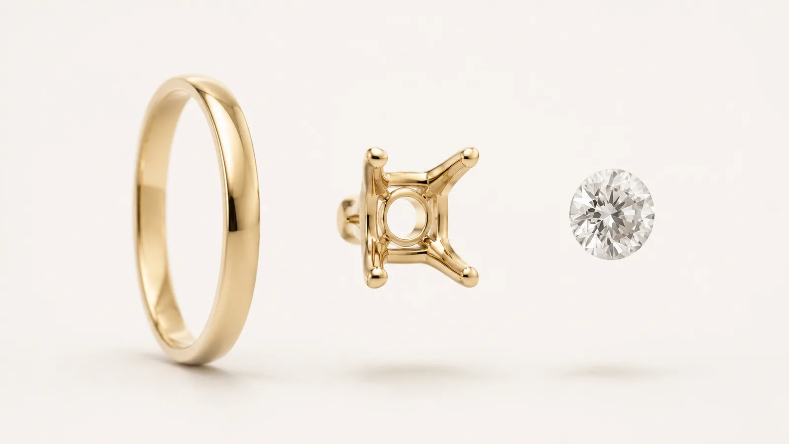 A plain gold wedding band, a four-prong ring setting and a loose round brilliant diamond floating apart in a row, a moment before assembly